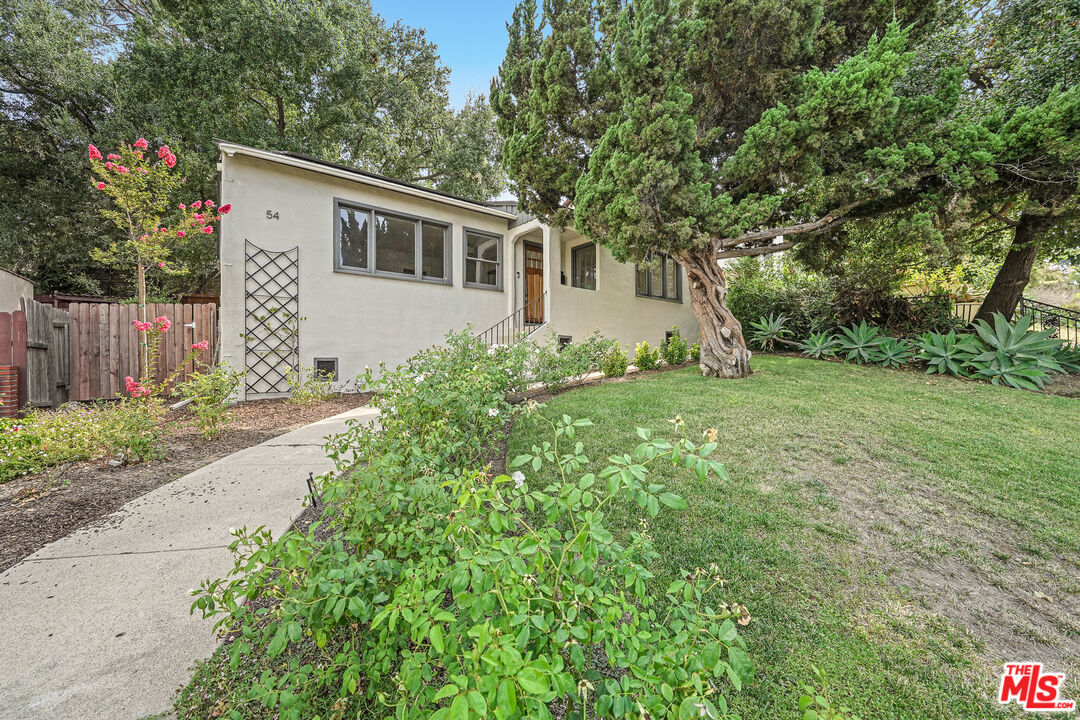 54 West Glenarm Street Pasadena, CA 91105 - Photo 16 of 18 a view of a house with a yard and garage