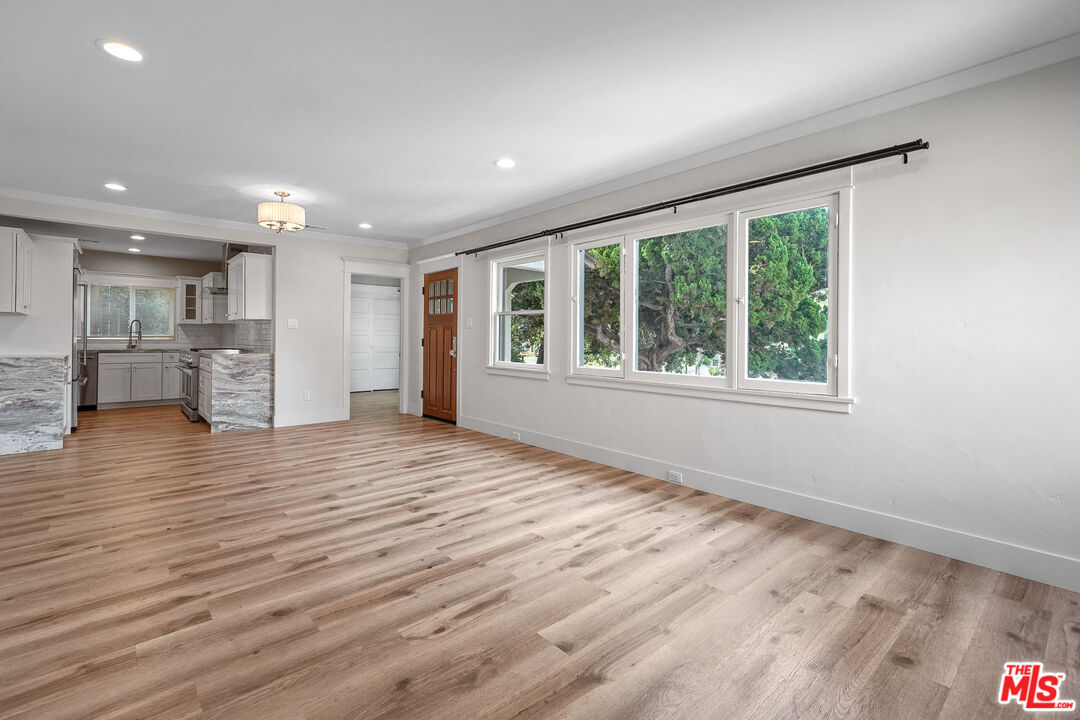 54 West Glenarm Street Pasadena, CA 91105 - Photo 2 of 18 a view of empty room with wooden floor and windows