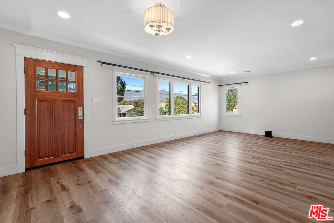54 West Glenarm Street Pasadena, CA 91105 - Photo 3 of 18 wooden floor in an empty room with a window