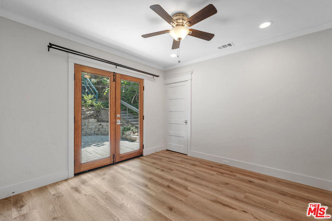 54 West Glenarm Street Pasadena, CA 91105 - Photo 10 of 18 an empty room with wooden floor and windows