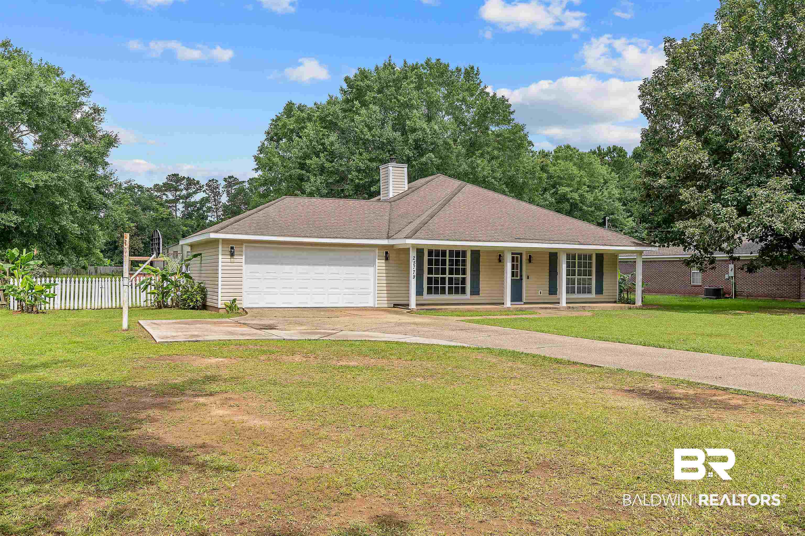 25779 Austin Road Daphne, AL 36526 - Photo 3 of 30 Single story home with a porch, a garage, concrete driveway, and a chimney