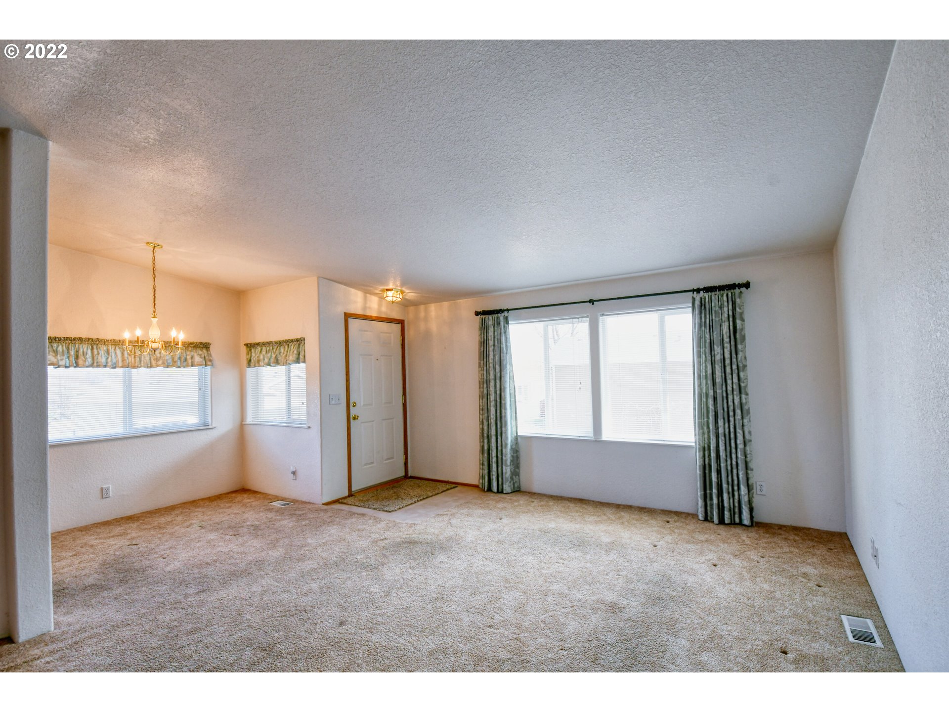 2600 Southwest Goodwin Avenue, Unit 15 Pendleton, OR 97801 - Photo 3 of 30 a view of an empty room with a window