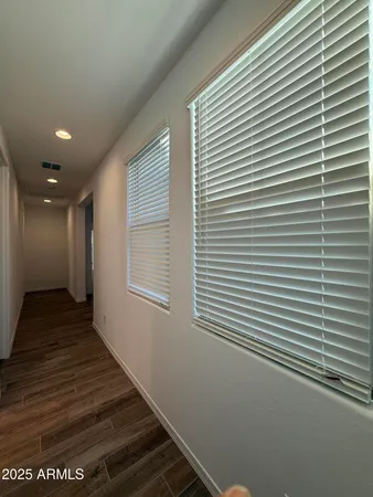 a view of a room with wooden floor
