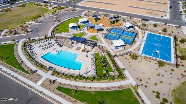 a view of a swimming pool with a lounge chairs
