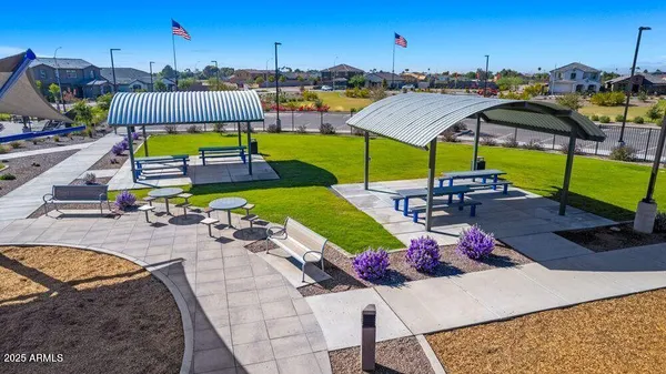 a view of a swimming pool with outdoor seating