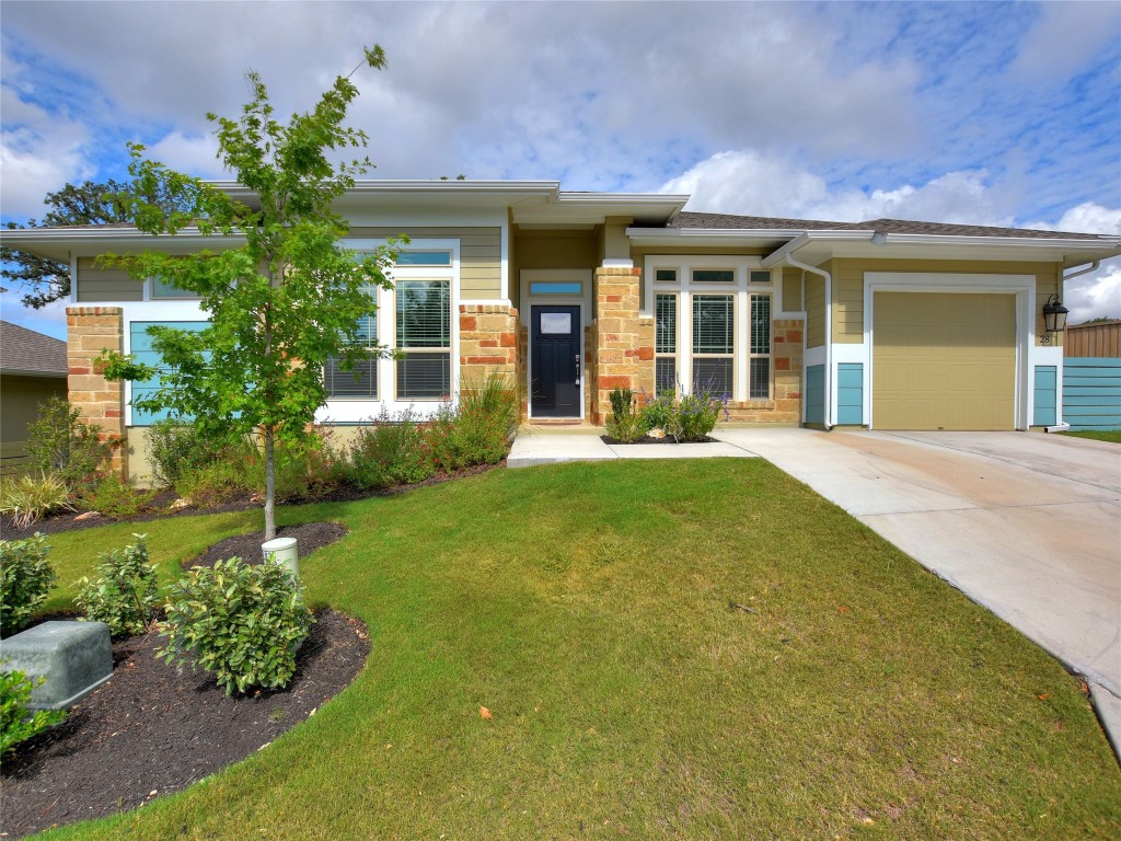 front view of a house with a yard