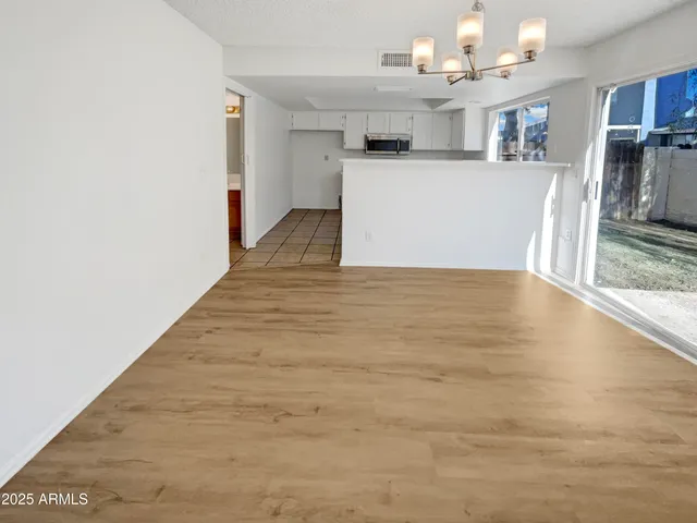 a kitchen with granite countertop a stove and a sink