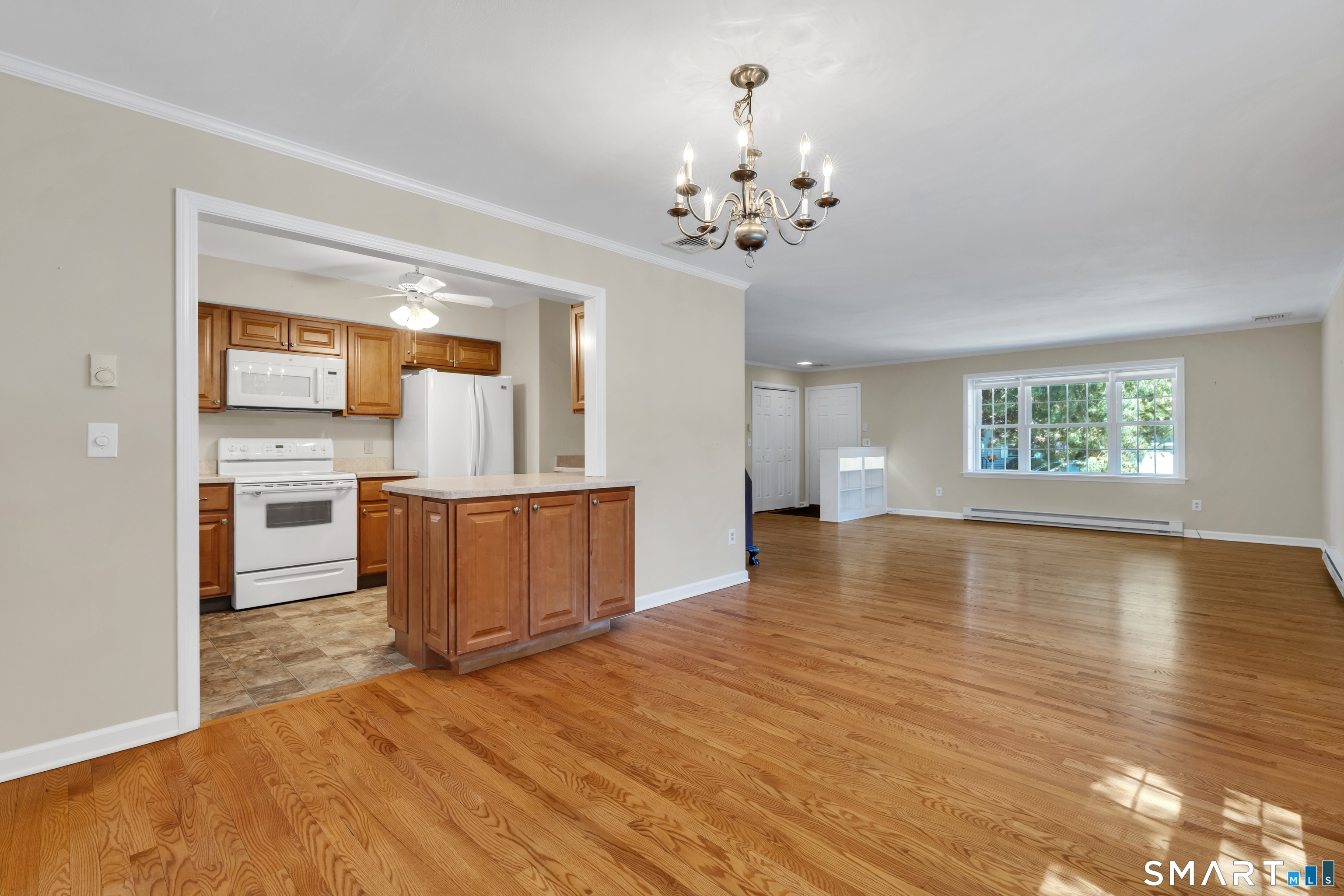 28 Downing Way, Unit 28 Madison, CT 06443 - Photo 6 of 30 Living room, dining room, family room.