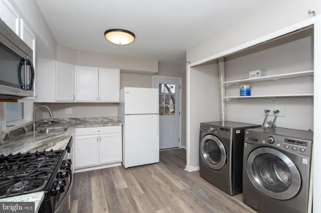 a kitchen with a stove and a microwave