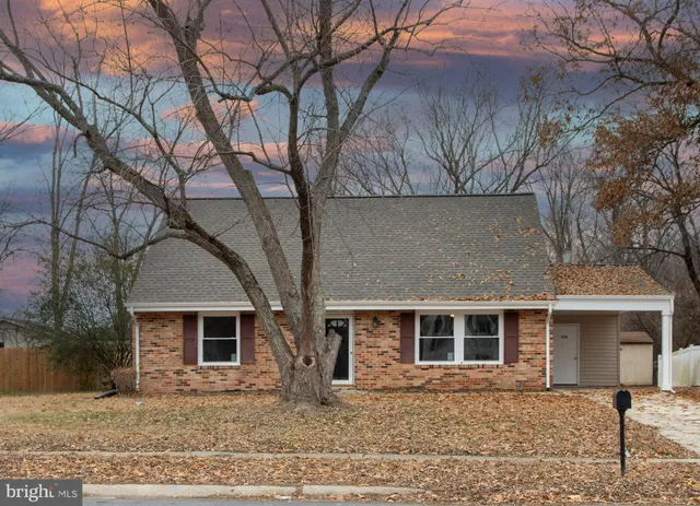 a front view of a house with yard
