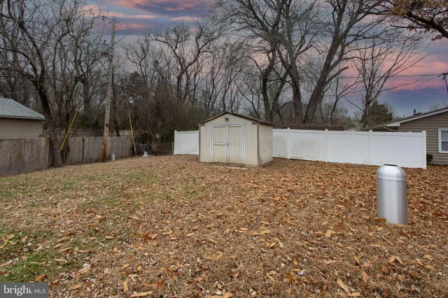 a front view of house with yard and trees