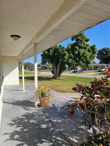 a kitchen with stainless steel appliances granite countertop a refrigerator sink and cabinets