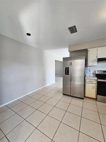 a bathroom with a sink a toilet and a large mirror