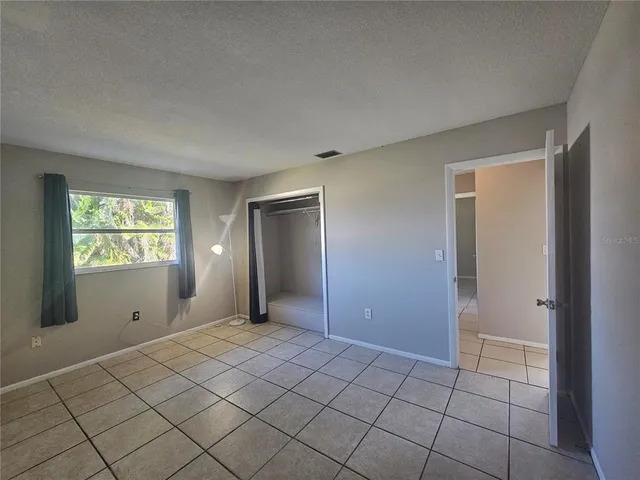 an aerial view of residential houses with city view