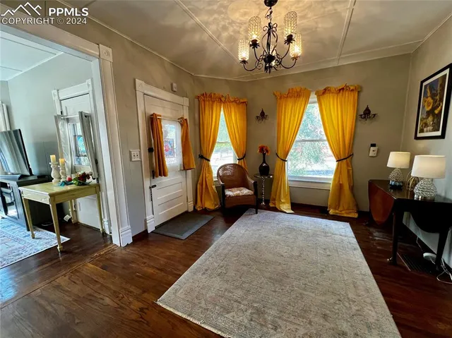 a view of living room with furniture and window