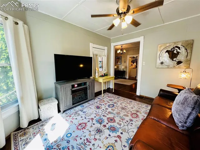 a bedroom with a bed and a television