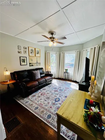 a living room with couch and a flat screen tv