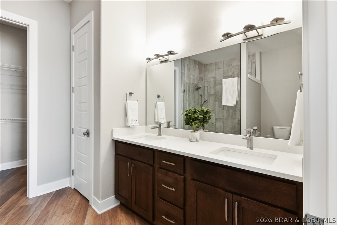 1184 Jeffries Road, Unit 318 Osage Beach, MO 65065 - Photo 16 of 51 Primary bath has the same cabinetry and counters t