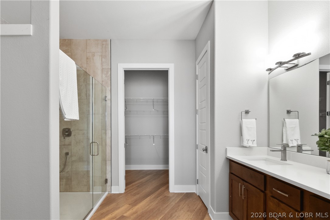1184 Jeffries Road, Unit 318 Osage Beach, MO 65065 - Photo 22 of 51 Primary bathroom. His/her vanites, stunning tile