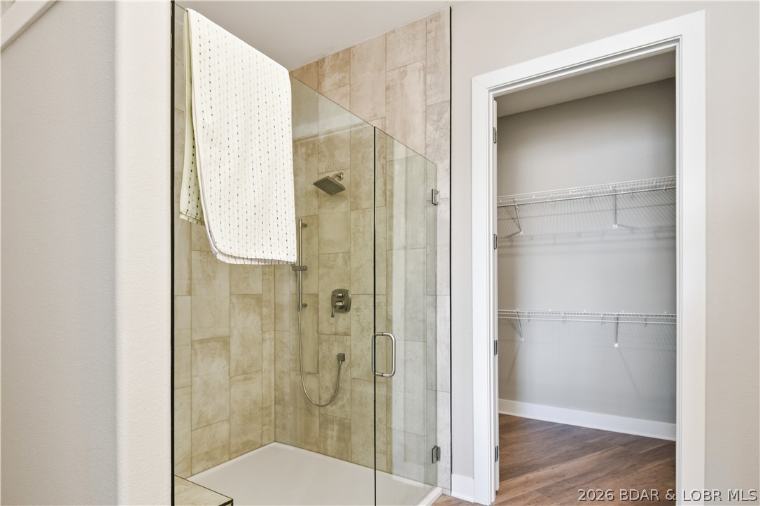 1184 Jeffries Road, Unit 318 Osage Beach, MO 65065 - Photo 41 of 51 The tall tiled showers are a great touch to the al