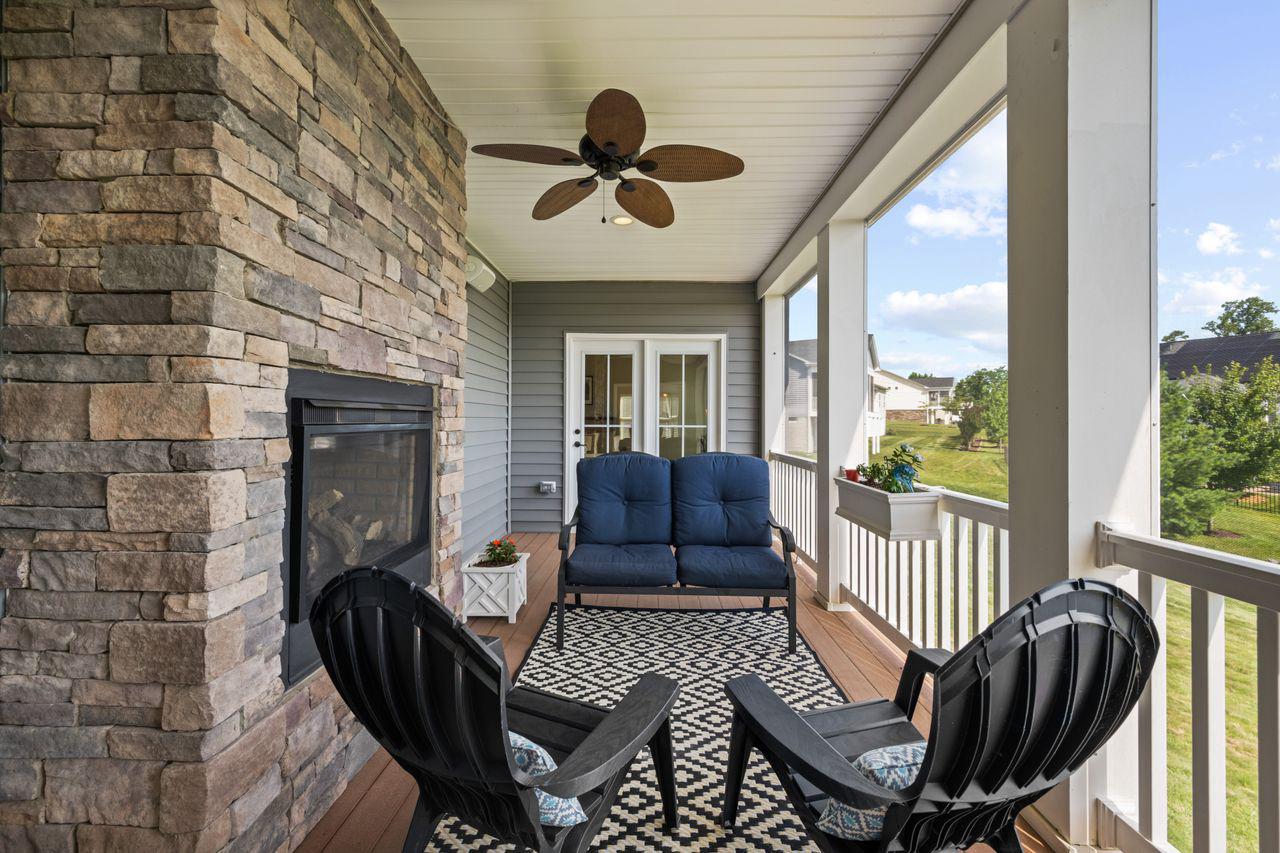 3026 Sunny Ridge Drive Odenton, MD 21113 - Photo 14 of 49 Charming screened porch with gas fireplace