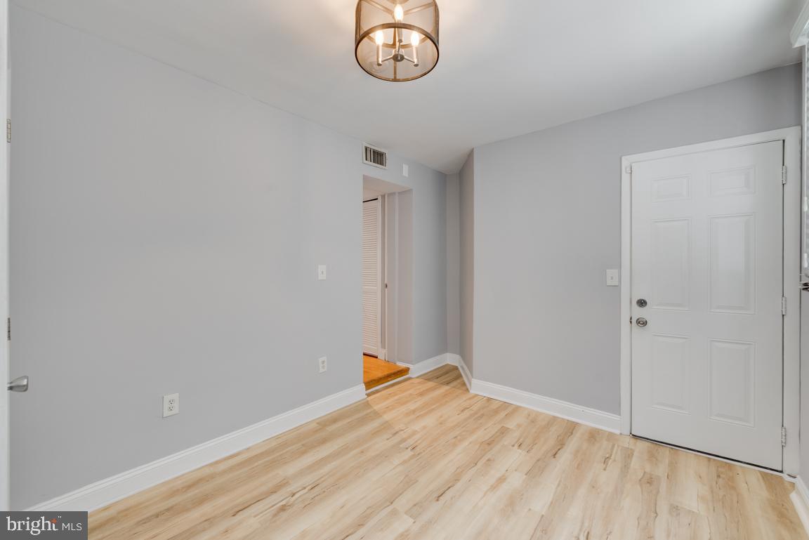 1333 Adams Street Northeast, Unit 2 Washington, DC 20018 - Photo 18 of 20 a view of empty room with wooden floor
