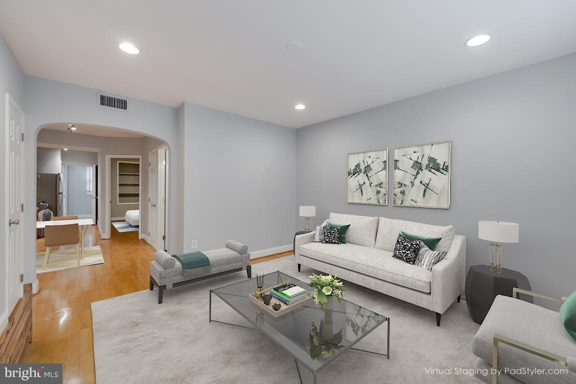 1333 Adams Street Northeast, Unit 2 Washington, DC 20018 - Photo 2 of 20 a living room with furniture and a potted plant