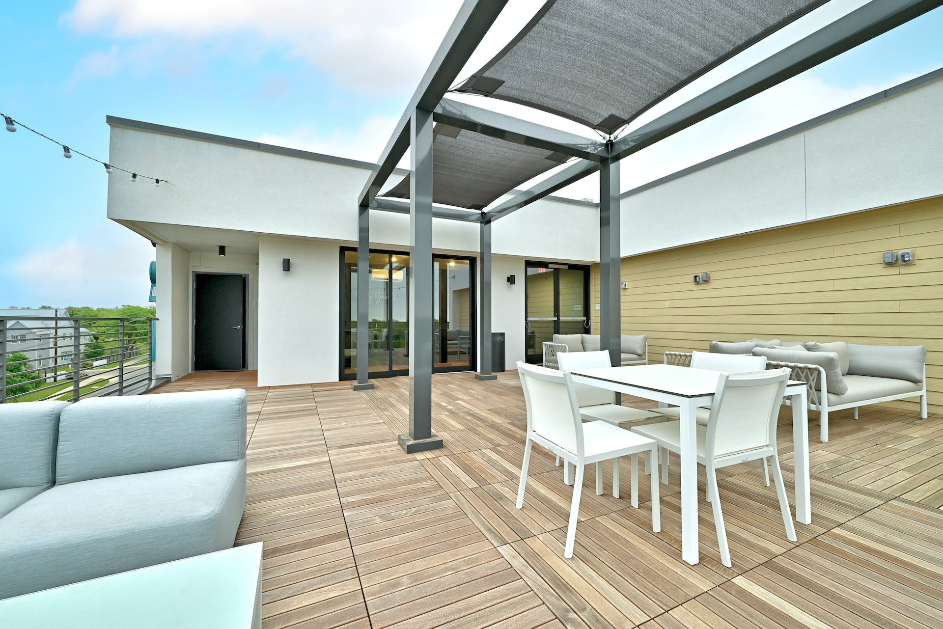 4801 Springdale Road, Unit 1301 Austin, TX 78723 - Photo 32 of 39 A spacious rooftop terrace with wood flooring offers an ideal setting for relaxation.