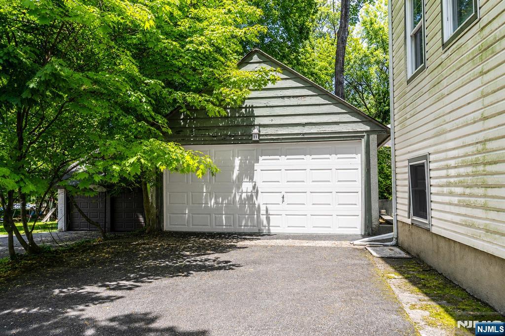 298 Audubon Road Englewood, NJ 07631 - Photo 19 of 19 a front view of a house with a garage