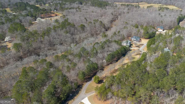 a aerial view of a house with a yard