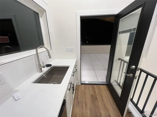 a bathroom with a sink and mirror