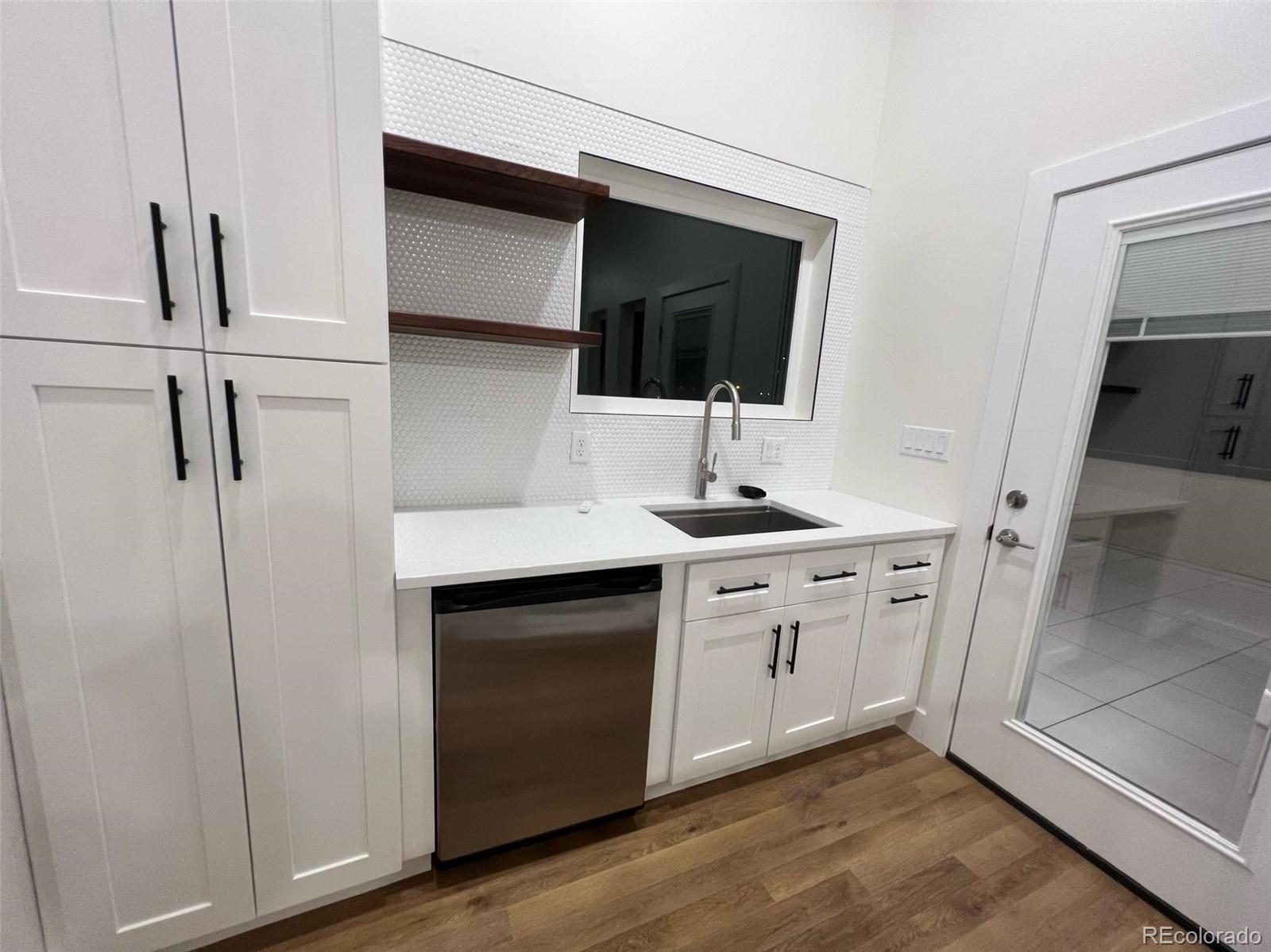 2398 Ridge Cir Drive, Unit A Grand Junction, CO 81507 - Photo 18 of 30 a bathroom with a sink and mirror