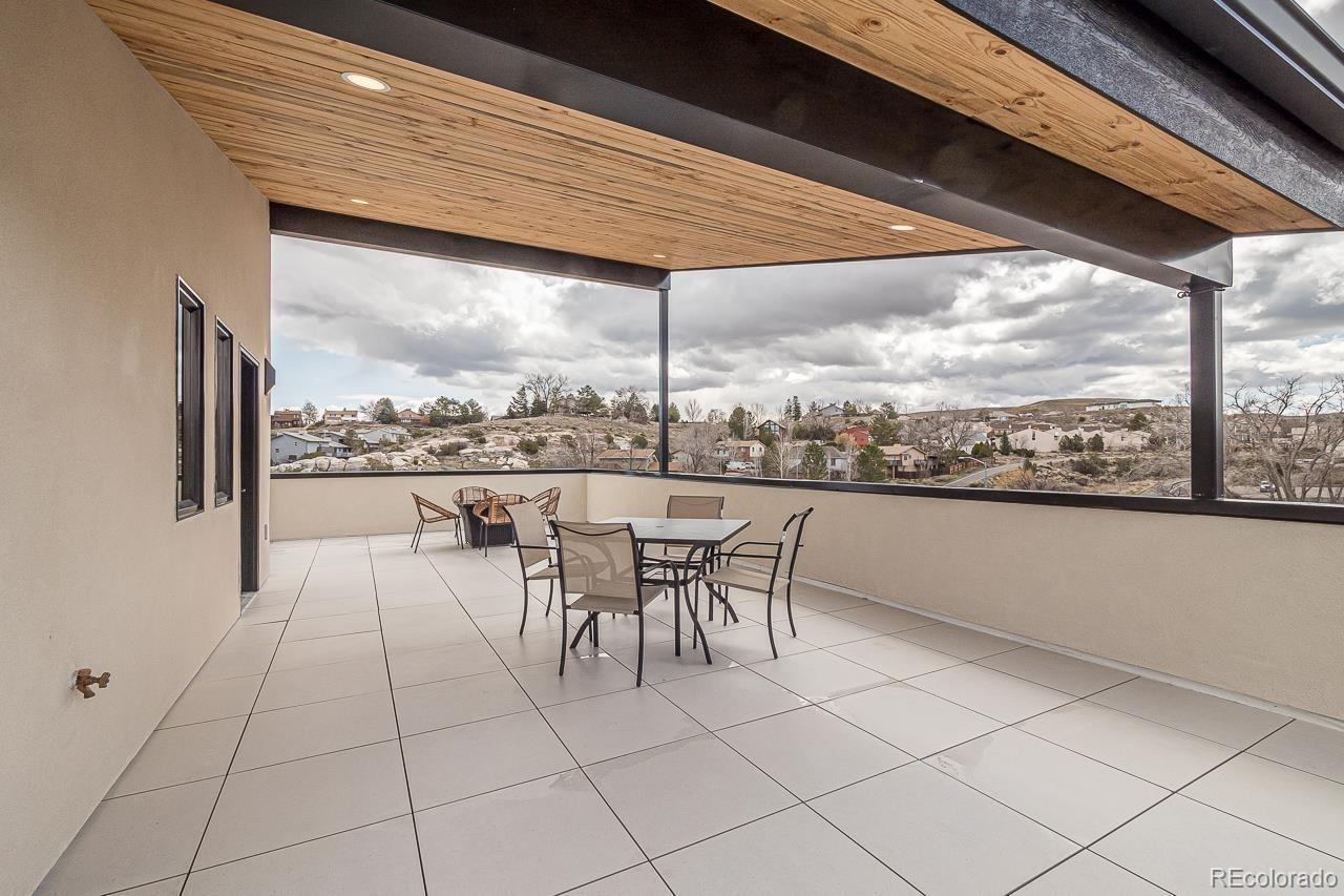 2398 Ridge Cir Drive, Unit A Grand Junction, CO 81507 - Photo 19 of 30 a dining room with furniture and a floor to ceiling window