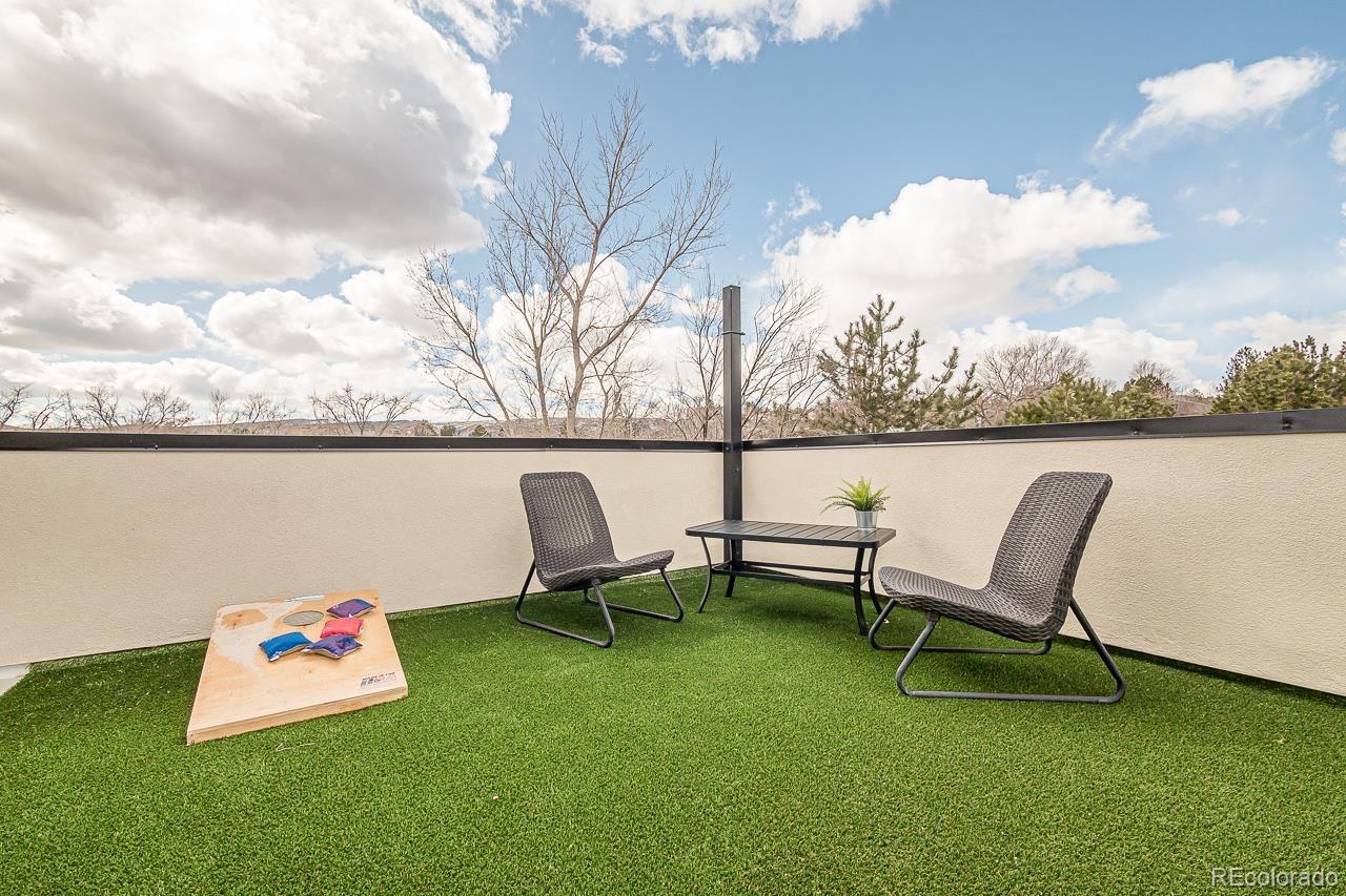 2398 Ridge Cir Drive, Unit A Grand Junction, CO 81507 - Photo 24 of 30 a roof deck with table and chairs