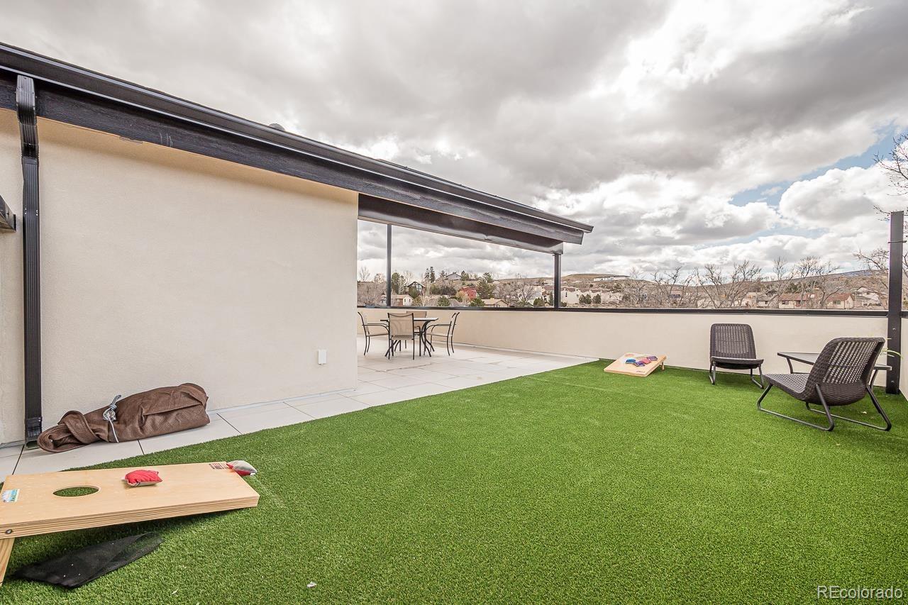 2398 Ridge Cir Drive, Unit A Grand Junction, CO 81507 - Photo 27 of 30 a view of swimming pool with a garden and lawn chairs