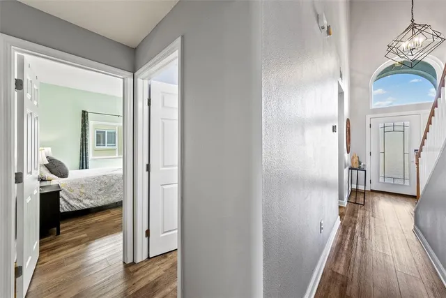a living room with wooden floor furniture and a window