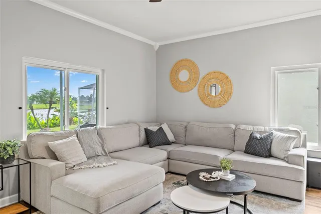 a living room with furniture and a window