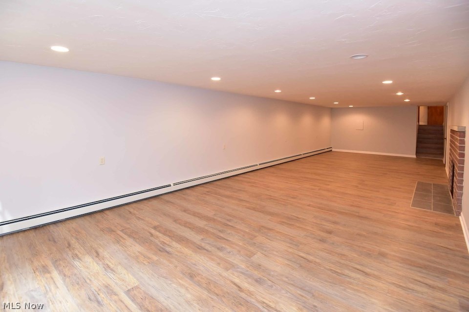 295 River Road Hinckley, OH 44233 - Photo 8 of 25 Beautifully finished 42 x 14 lower level with woodburning fireplace, recessed lighting, newly installed baseboard heating and just seven steps from the full bath / mudroom entry. Its twin unfinished side is just as large!