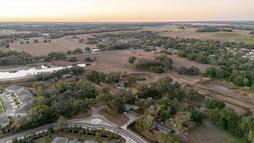 36630 Sunshine Road Zephyrhills, FL 33541 - Photo 16 of 20 an aerial view of multiple house