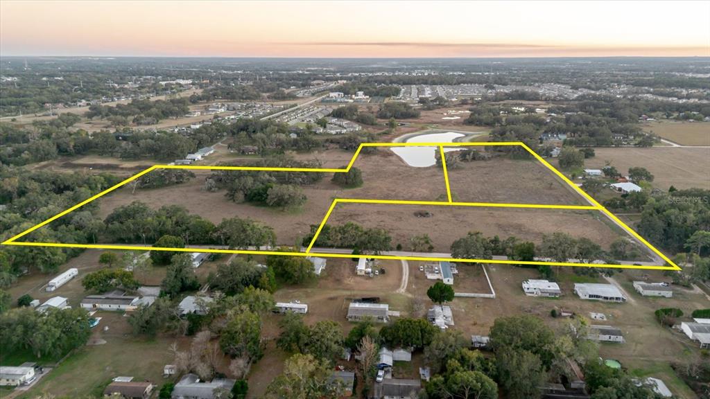 36630 Sunshine Road Zephyrhills, FL 33541 - Photo 3 of 20 an aerial view of residential houses with outdoor space