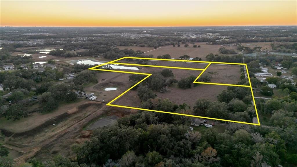 36630 Sunshine Road Zephyrhills, FL 33541 - Photo 5 of 20 an aerial view of a house with a yard