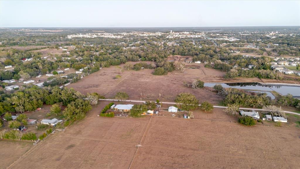 36630 Sunshine Road Zephyrhills, FL 33541 - Photo 9 of 20 an aerial view of a city with lots of residential buildings