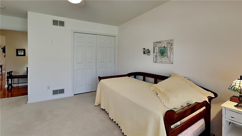 113 Clover Road Baden, PA 15005 - Photo 29 of 50 a bedroom with a bed and a cabinets