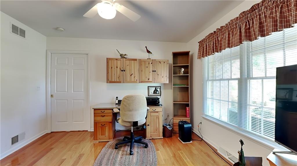 113 Clover Road Baden, PA 15005 - Photo 31 of 50 a work room with furniture and wooden floor