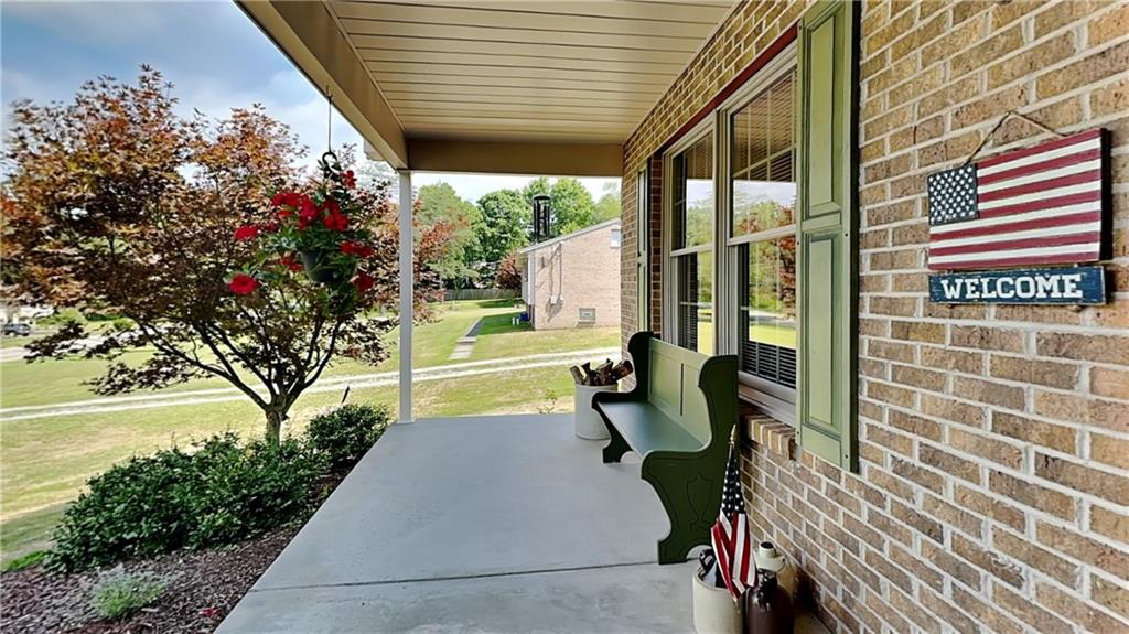 113 Clover Road Baden, PA 15005 - Photo 4 of 50 a view of a patio with table and chairs and potted plants