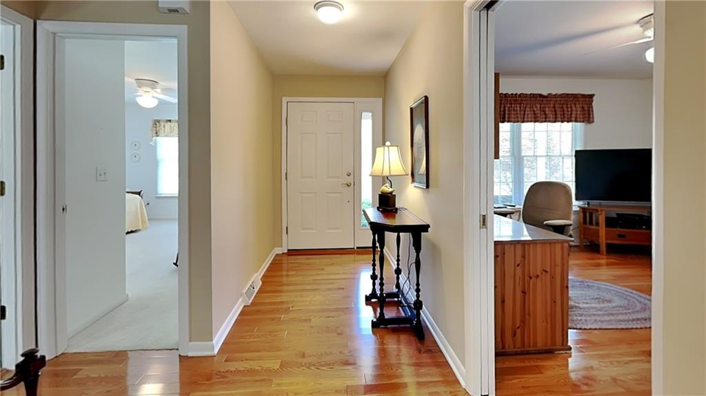 113 Clover Road Baden, PA 15005 - Photo 7 of 50 a view of a workspace with wooden floor and windows