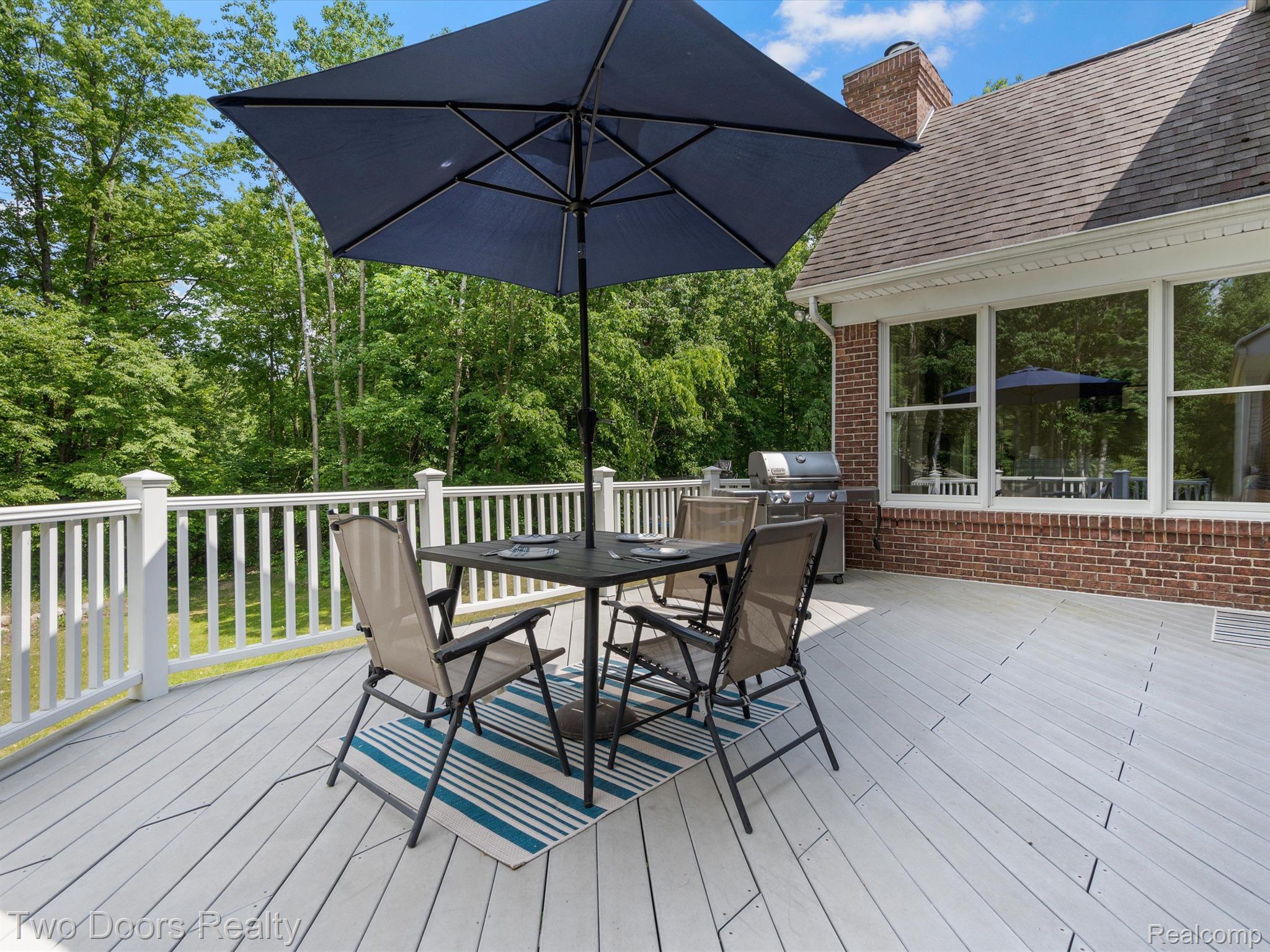 4060 Lake George Road Leonard, MI 48367 - Photo 16 of 86 Trex Deck off of Great Room/Kitchen