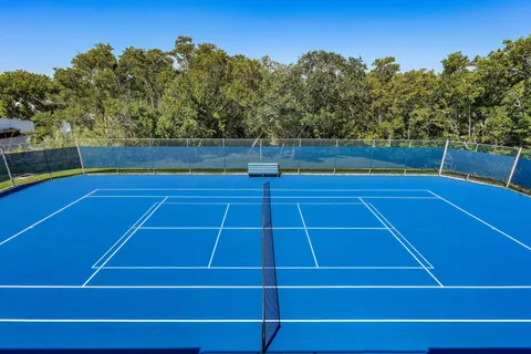 a view of a balcony with chairs