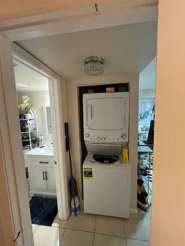 a utility room with closet dryer and washer