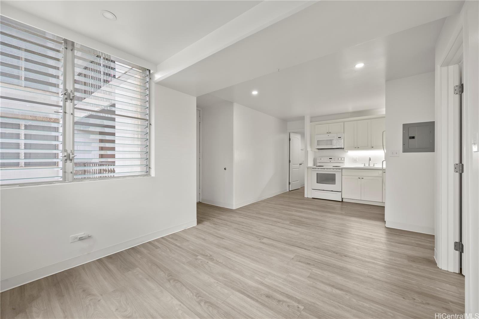 412 Launiu Street Honolulu, HI 96815 - Photo 12 of 20 a view of a kitchen with wooden floor and a sink